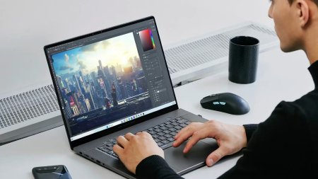 asus-rog-zephyrus-g16-16-inch-oled-being-used-on-a-table-with-a-mouse-nearby-1.jpg